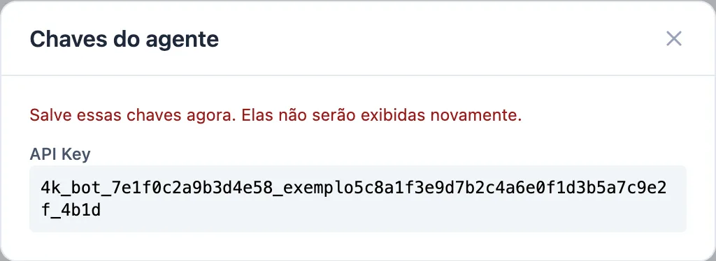 janela Chaves do agente com o aviso de que a chave não será exibida novamente e o campo API Key com uma chave fictícia